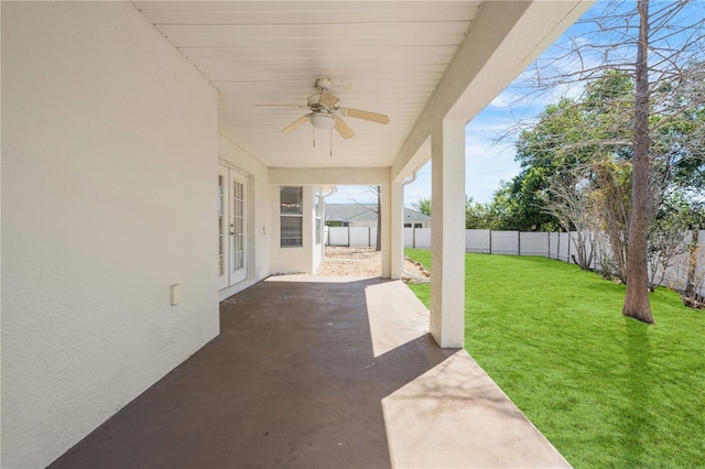 view of patio with a fenced backyard and a ceiling fan