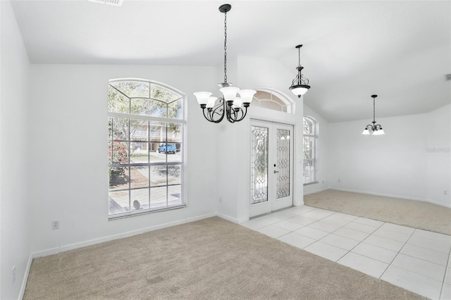 unfurnished dining area with lofted ceiling, carpet, and an inviting chandelier