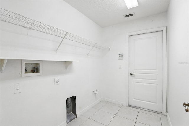 laundry area featuring visible vents, light tile patterned floors, laundry area, hookup for a washing machine, and hookup for an electric dryer