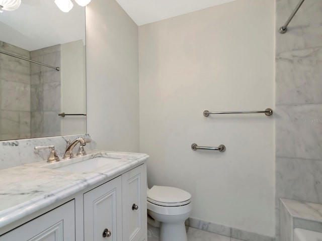 bathroom featuring toilet, walk in shower, and vanity