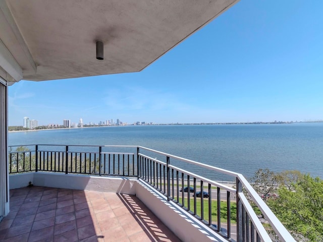 balcony with a view of city and a water view