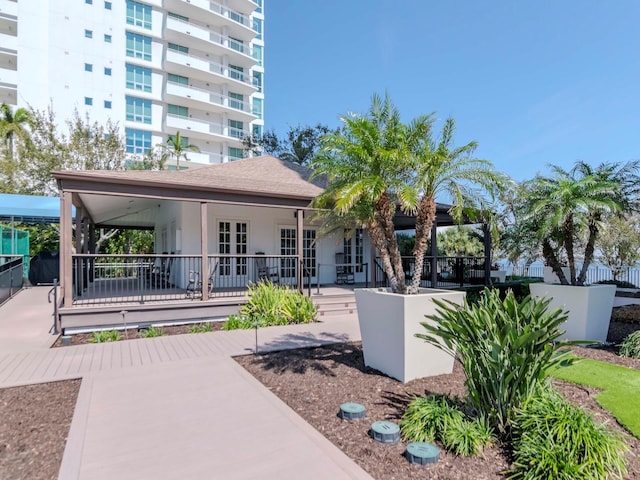 exterior space featuring stucco siding and fence