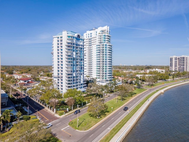 drone / aerial view with a view of city and a water view