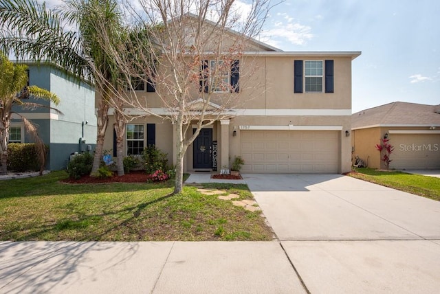 traditional-style home with a garage, stucco siding, concrete driveway, and a front lawn