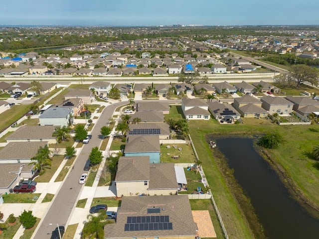 birds eye view of property with a residential view