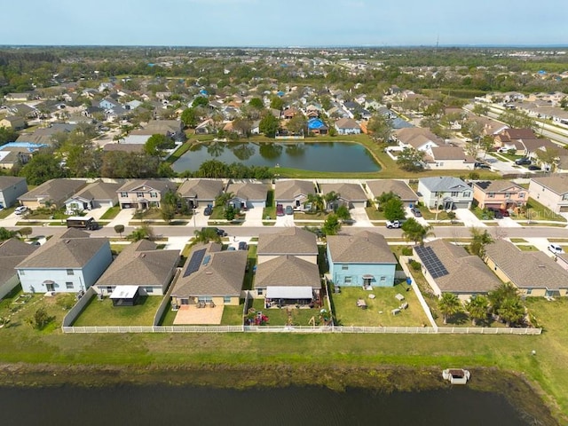 bird's eye view with a residential view and a water view