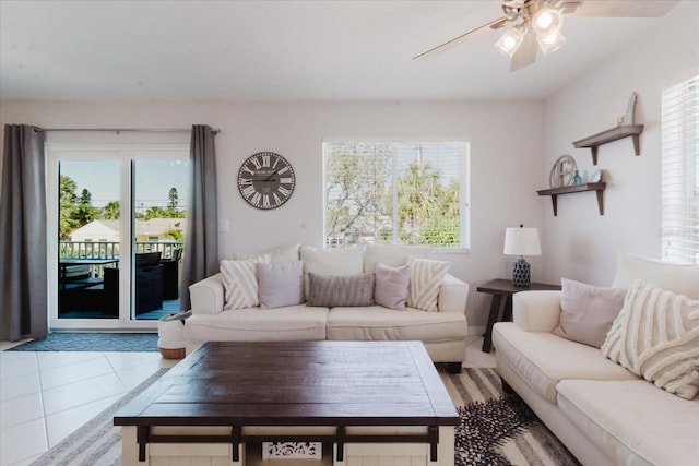 tiled living area featuring a ceiling fan