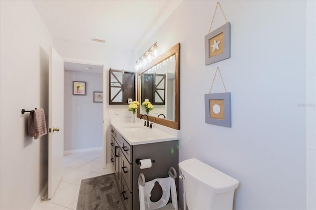 bathroom featuring tile patterned floors, visible vents, toilet, baseboards, and vanity