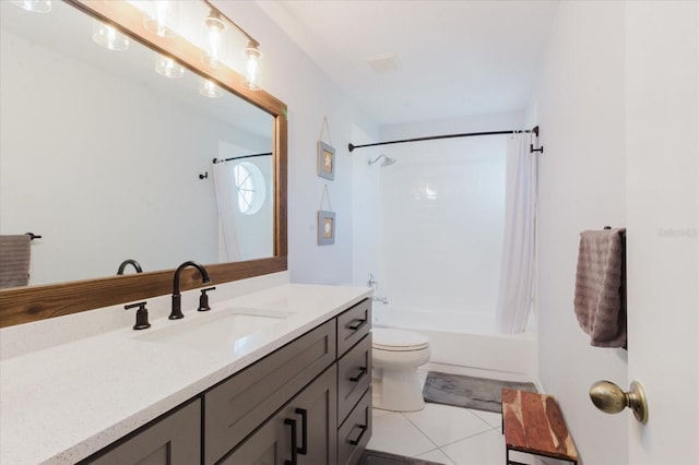 bathroom with tile patterned floors, toilet, vanity, and shower / bath combo