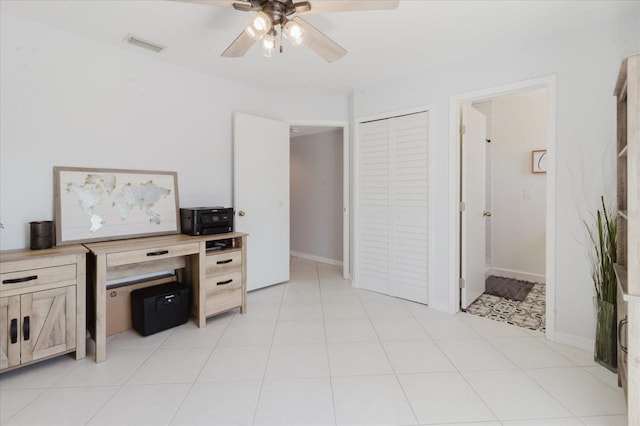 office area featuring baseboards, visible vents, and ceiling fan