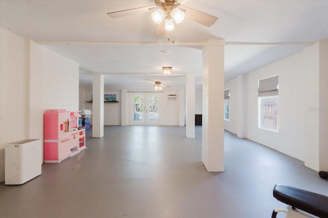 interior space with ceiling fan