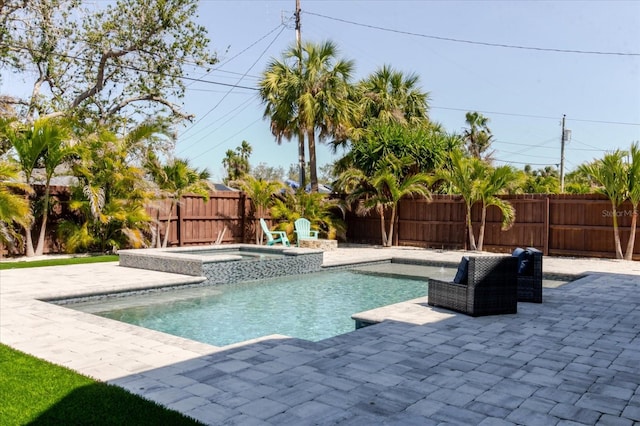 view of swimming pool with a fenced in pool, an in ground hot tub, a fenced backyard, and a patio area