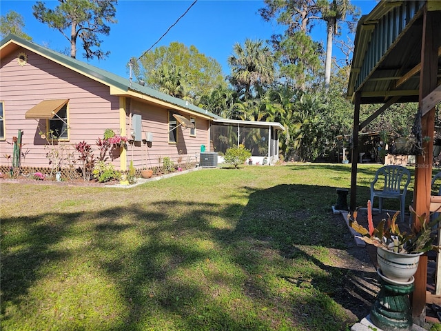 view of yard with a sunroom