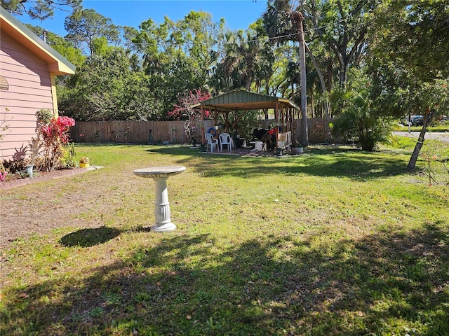 view of yard with a gazebo and a fenced backyard