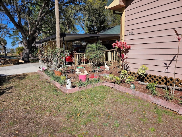 view of side of home featuring a yard