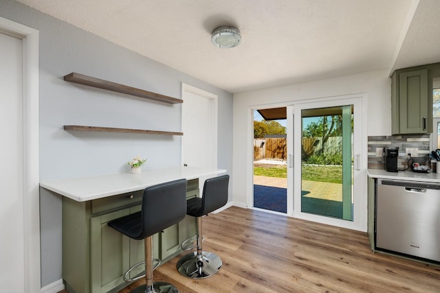 interior space featuring light wood-type flooring and baseboards