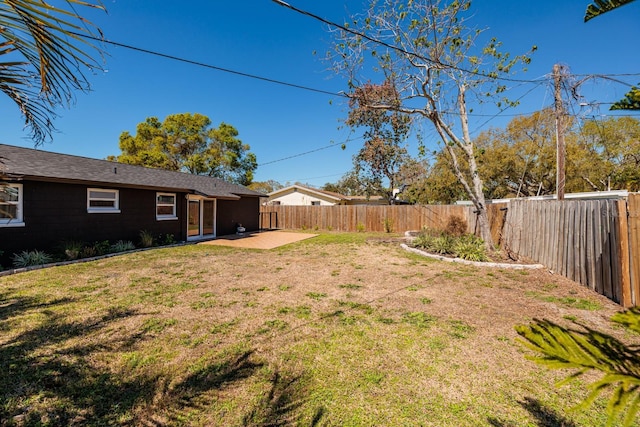 view of yard with a patio area and a fenced backyard