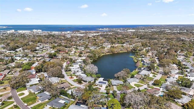 birds eye view of property featuring a water view and a residential view