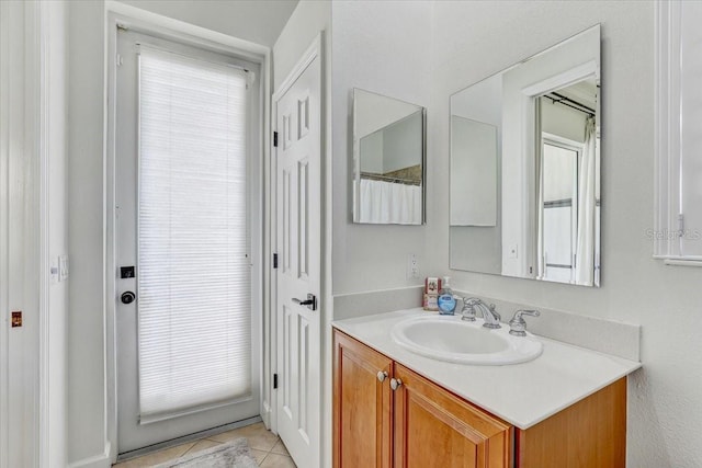 full bath with tile patterned flooring and vanity