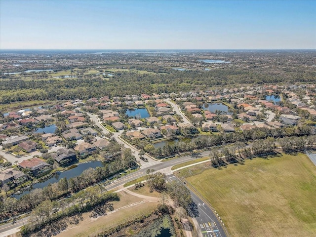 birds eye view of property featuring a residential view and a water view