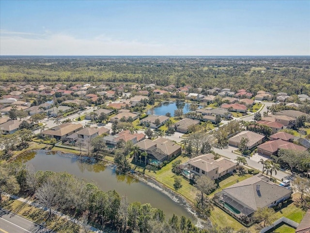 birds eye view of property featuring a residential view and a water view