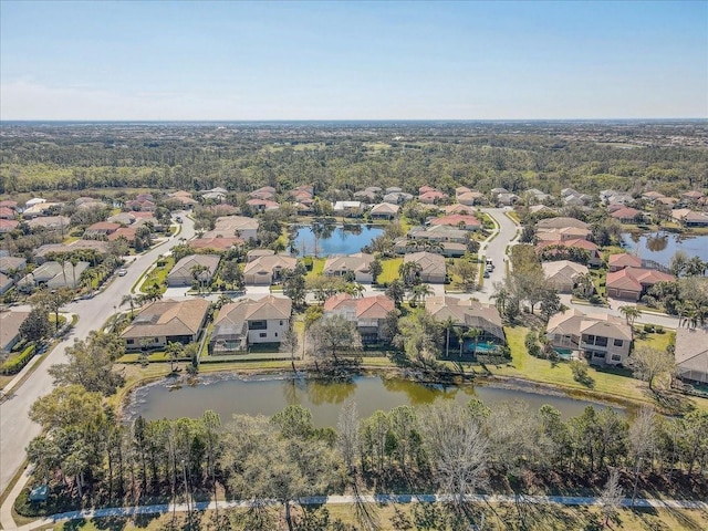 aerial view featuring a residential view and a water view