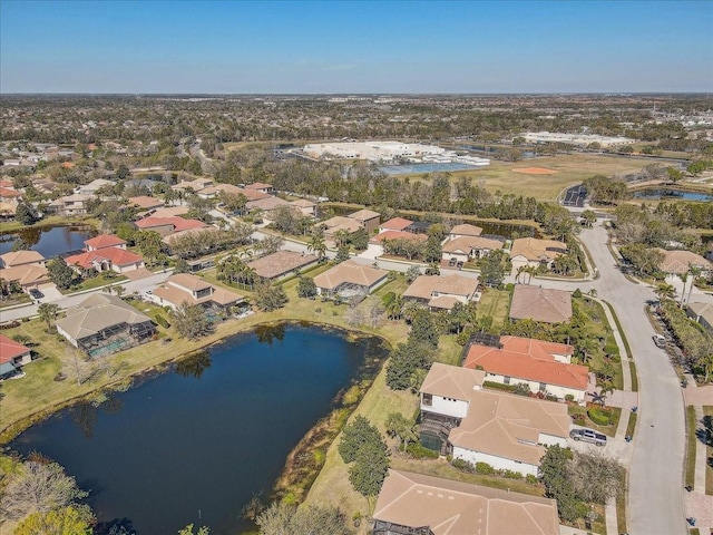 bird's eye view featuring a residential view and a water view