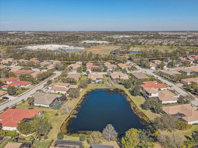 birds eye view of property featuring a residential view and a water view