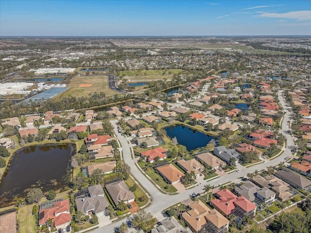 birds eye view of property featuring a residential view and a water view