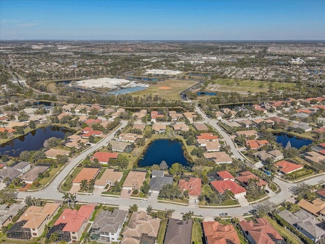 bird's eye view with a residential view and a water view