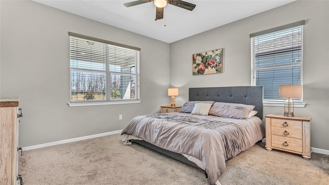 bedroom with baseboards, light colored carpet, and ceiling fan