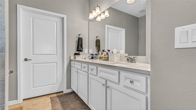 full bath with double vanity, visible vents, tile patterned floors, and a sink