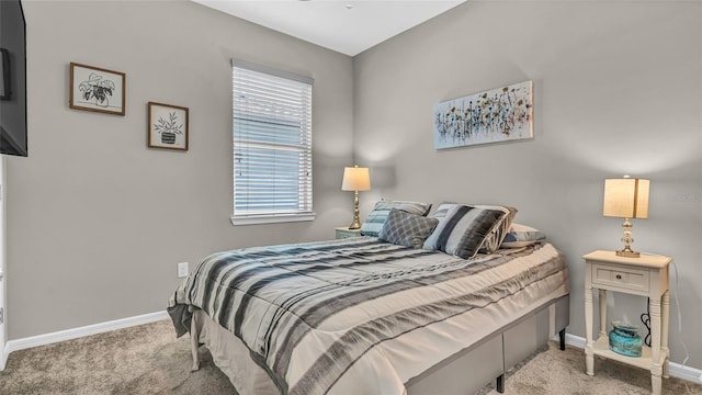 carpeted bedroom featuring baseboards