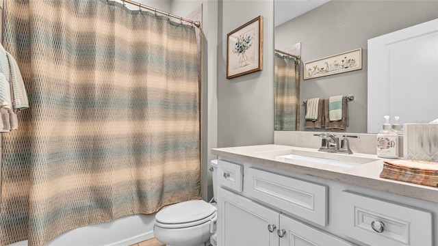 full bathroom featuring vanity, shower / tub combo, and toilet