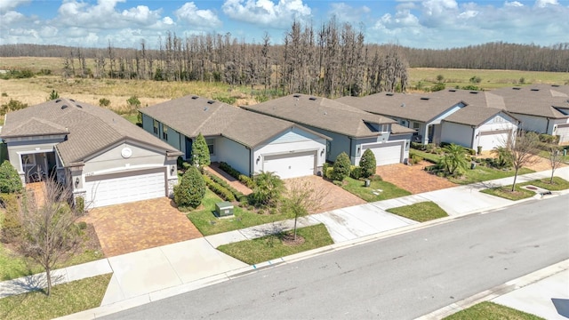 aerial view featuring a residential view and a view of trees