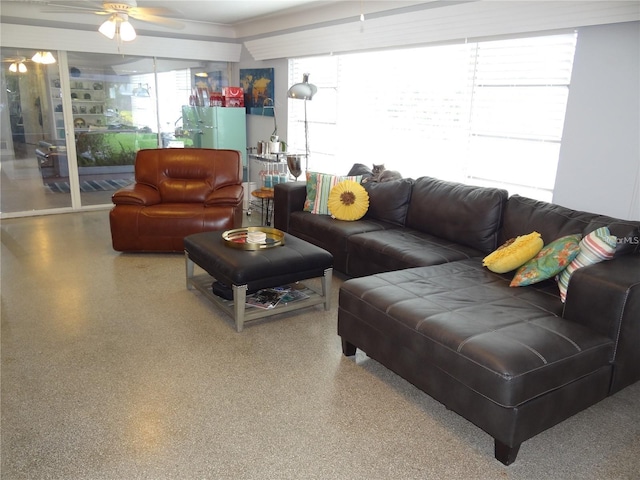 living room with speckled floor and a ceiling fan