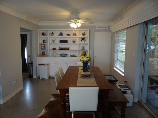 dining room with visible vents, baseboards, and a ceiling fan