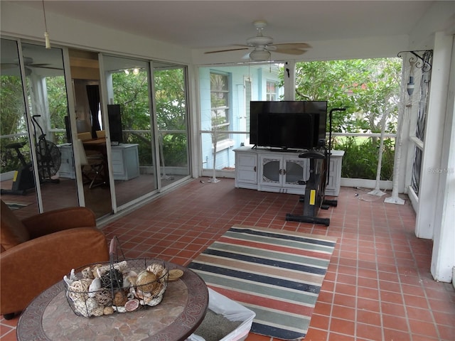 sunroom / solarium with plenty of natural light and a ceiling fan