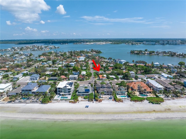 drone / aerial view featuring a residential view and a water view