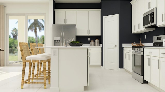 kitchen featuring white cabinetry, appliances with stainless steel finishes, and light countertops