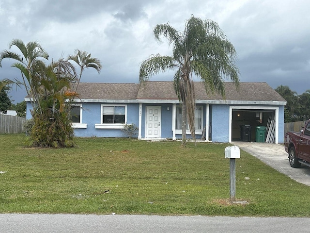 ranch-style house with fence, driveway, an attached garage, stucco siding, and a front lawn