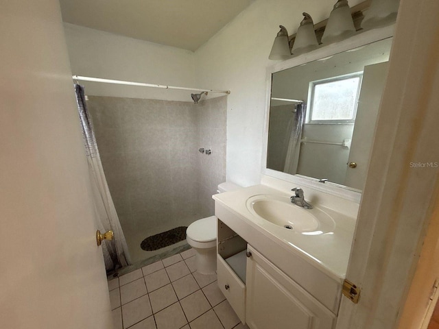full bathroom with vanity, a shower stall, toilet, and tile patterned floors