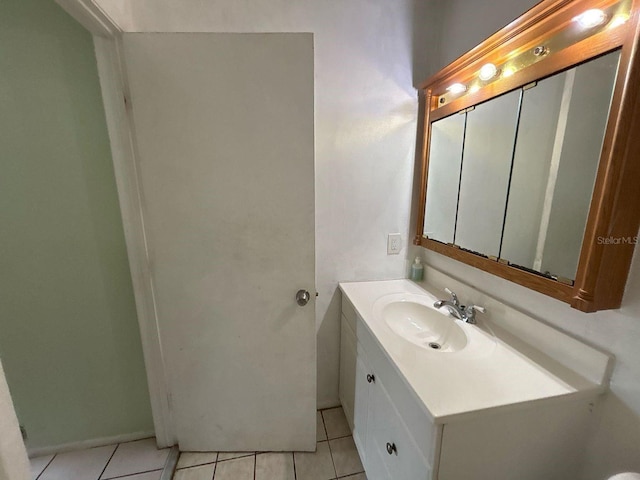 bathroom featuring tile patterned flooring and vanity