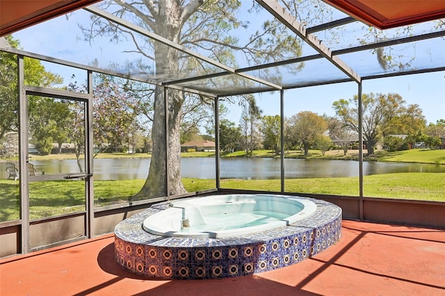 unfurnished sunroom with a jacuzzi and a water view