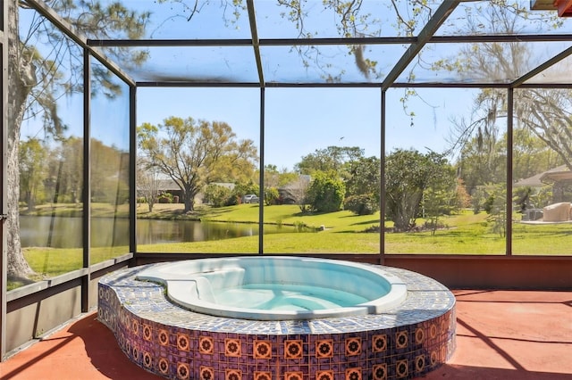 sunroom with a water view and a hot tub