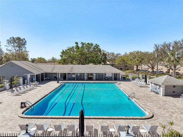 pool featuring a patio area and fence