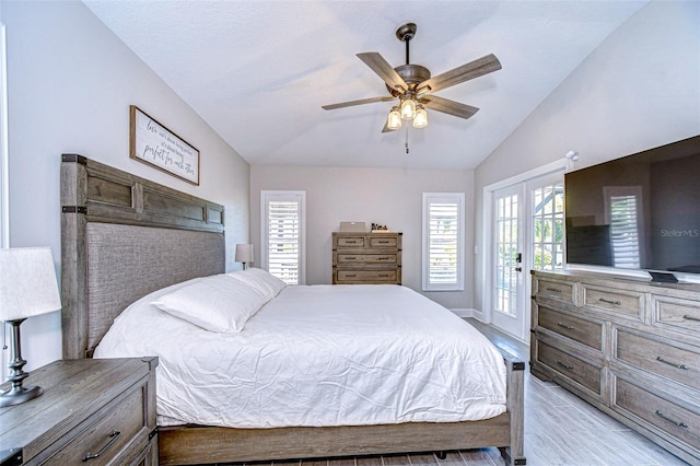 bedroom featuring baseboards, light wood finished floors, ceiling fan, vaulted ceiling, and access to outside