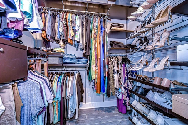 walk in closet featuring wood tiled floor