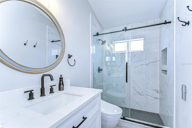 bathroom featuring a marble finish shower, marble finish floor, toilet, and vanity