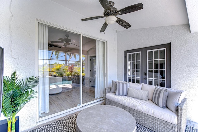 sunroom / solarium with french doors and a ceiling fan